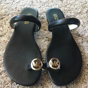 Micheal Kors Nora black with gold toe logo sandals